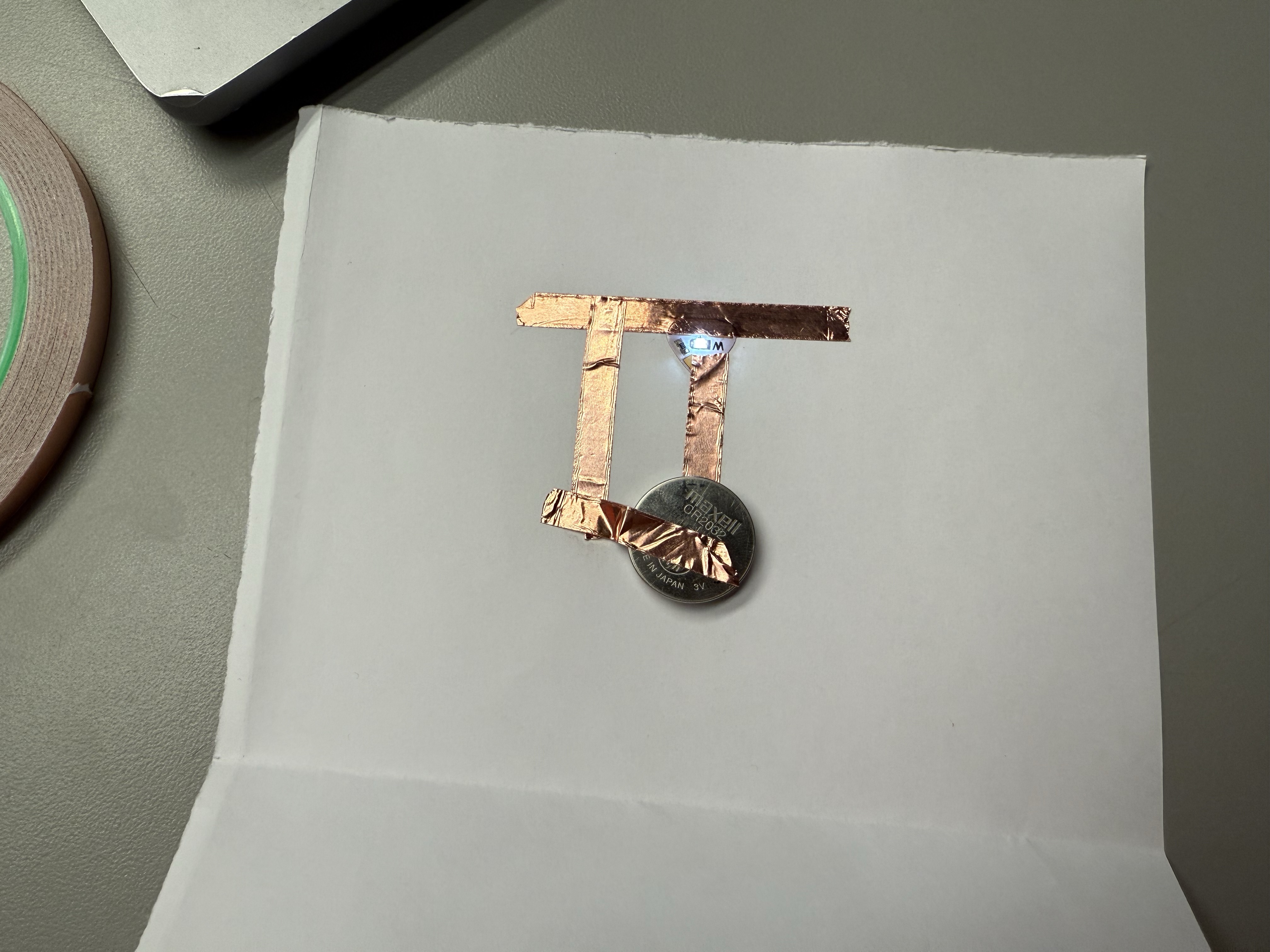 Finalized DIY circuit project with glowing LED stickers.