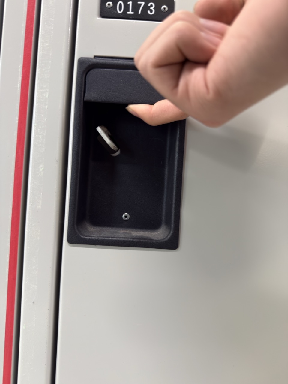 can be pulling a drawer open to reveal its contents.