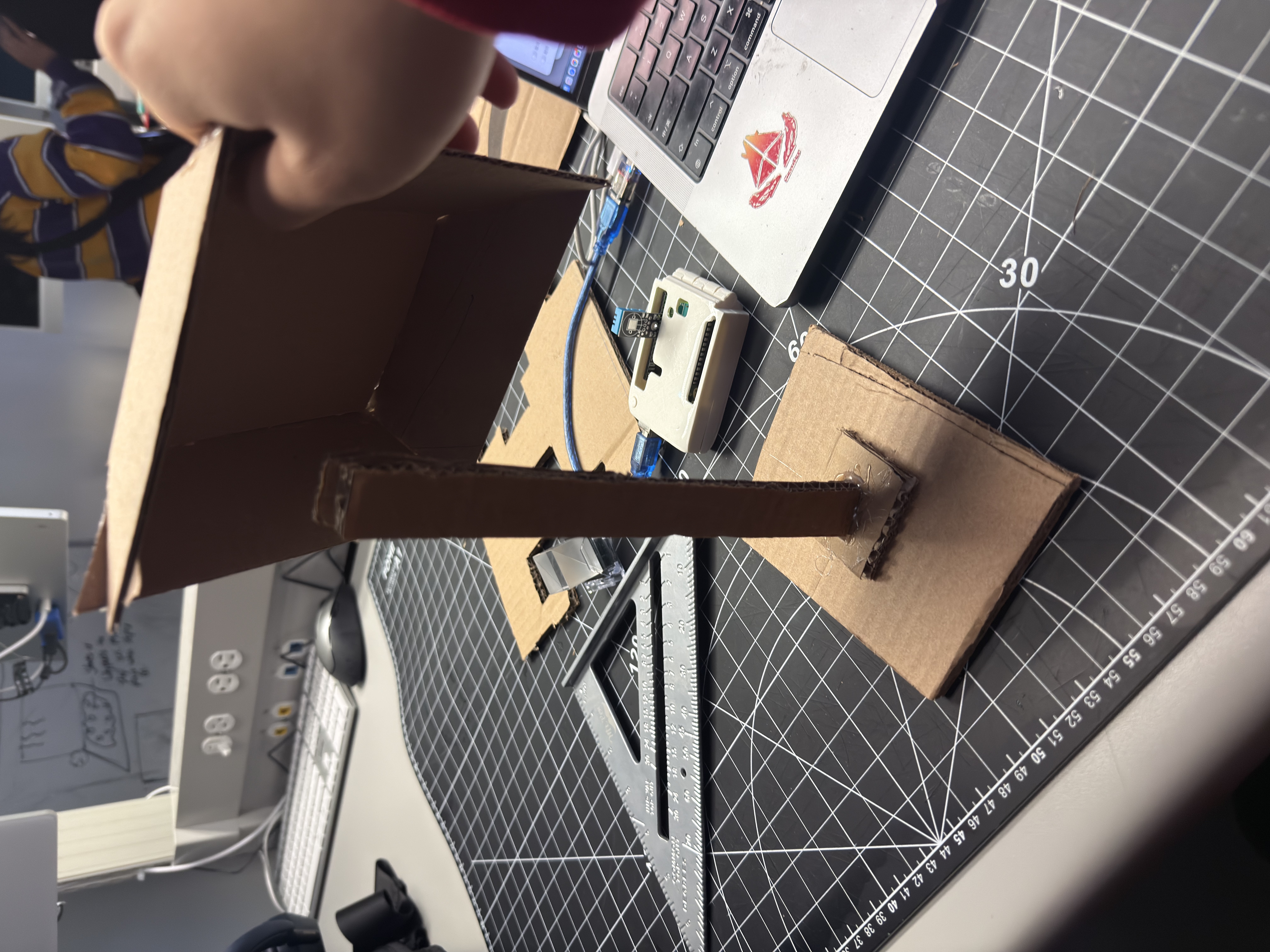 Step 2 — Shade mock-up: trial shade mounted on the post to simulate real torque. Problem: front tilt lifts the base; tipping risk is high. Decision: add a rear wedge brace or a twin-post layout to share the moment.